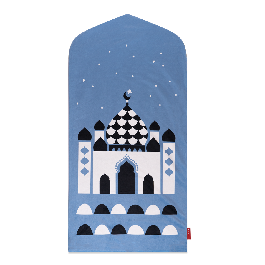 Image of blue prayer mat displayed in a child's bedroom: "Islamic wall art - our pink prayer rug for kids makes a beautiful and unique addition to any Islamic home decor collection."