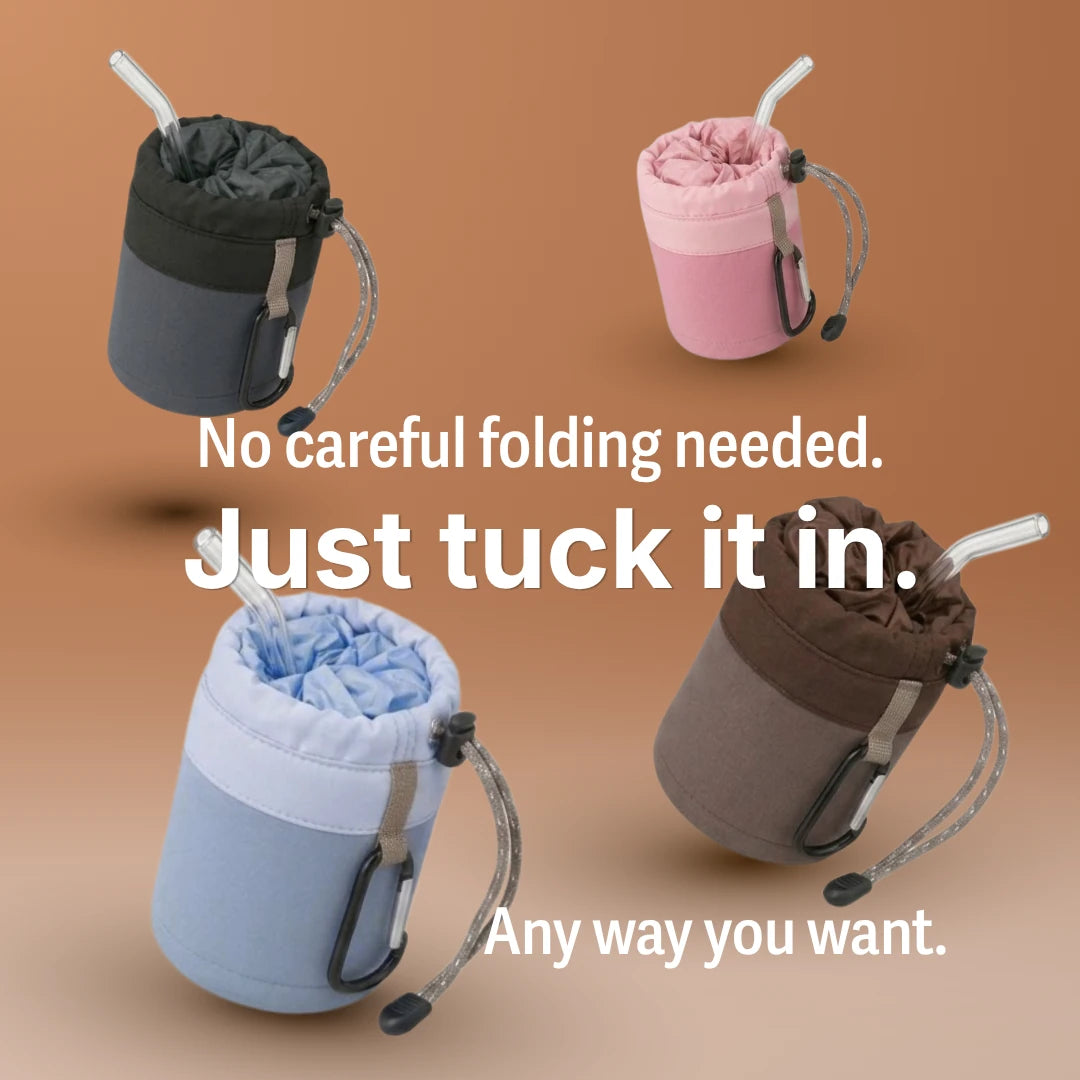 Four SalahWear travel telekung/mukena pouches in black, pink, blue, and brown, each loosely stuffed with fabric and a drinking straw — text overlay reads 'No careful folding needed. Just tuck it in. Any way you want,' showing the prayer dress packs without precise folding. Mobile copy