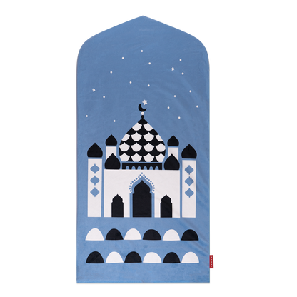 Image of blue prayer mat displayed in a child's bedroom: "Islamic wall art - our pink prayer rug for kids makes a beautiful and unique addition to any Islamic home decor collection."